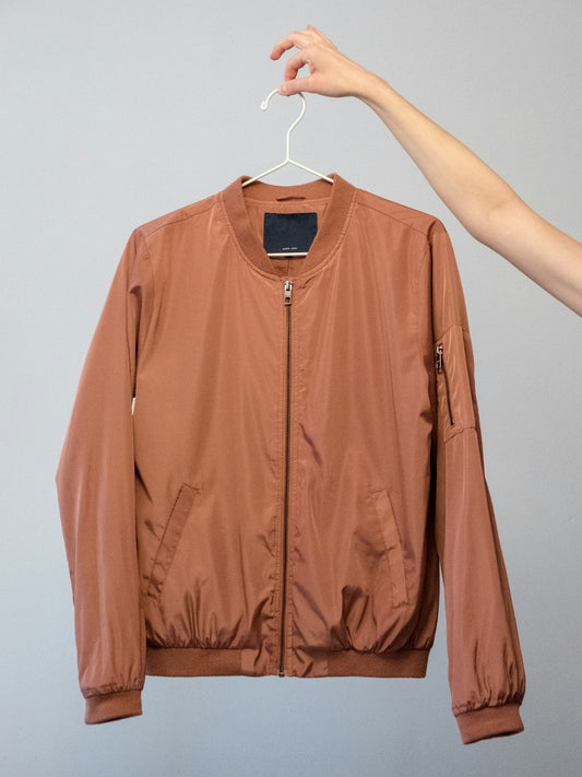 Fleece jacket hanging outdoors — how to care for fleece and prevent pilling